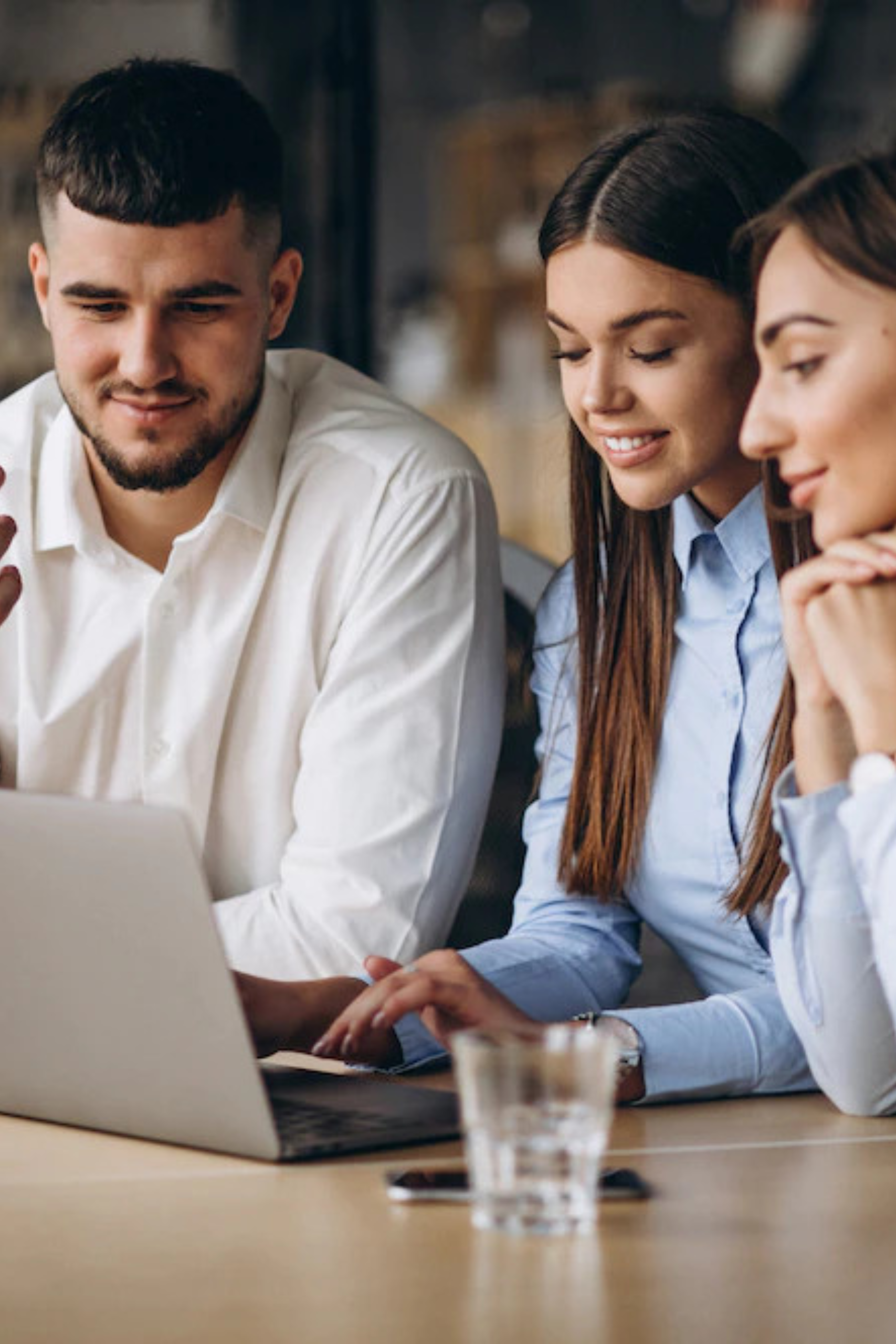 Group of people working on a laptop